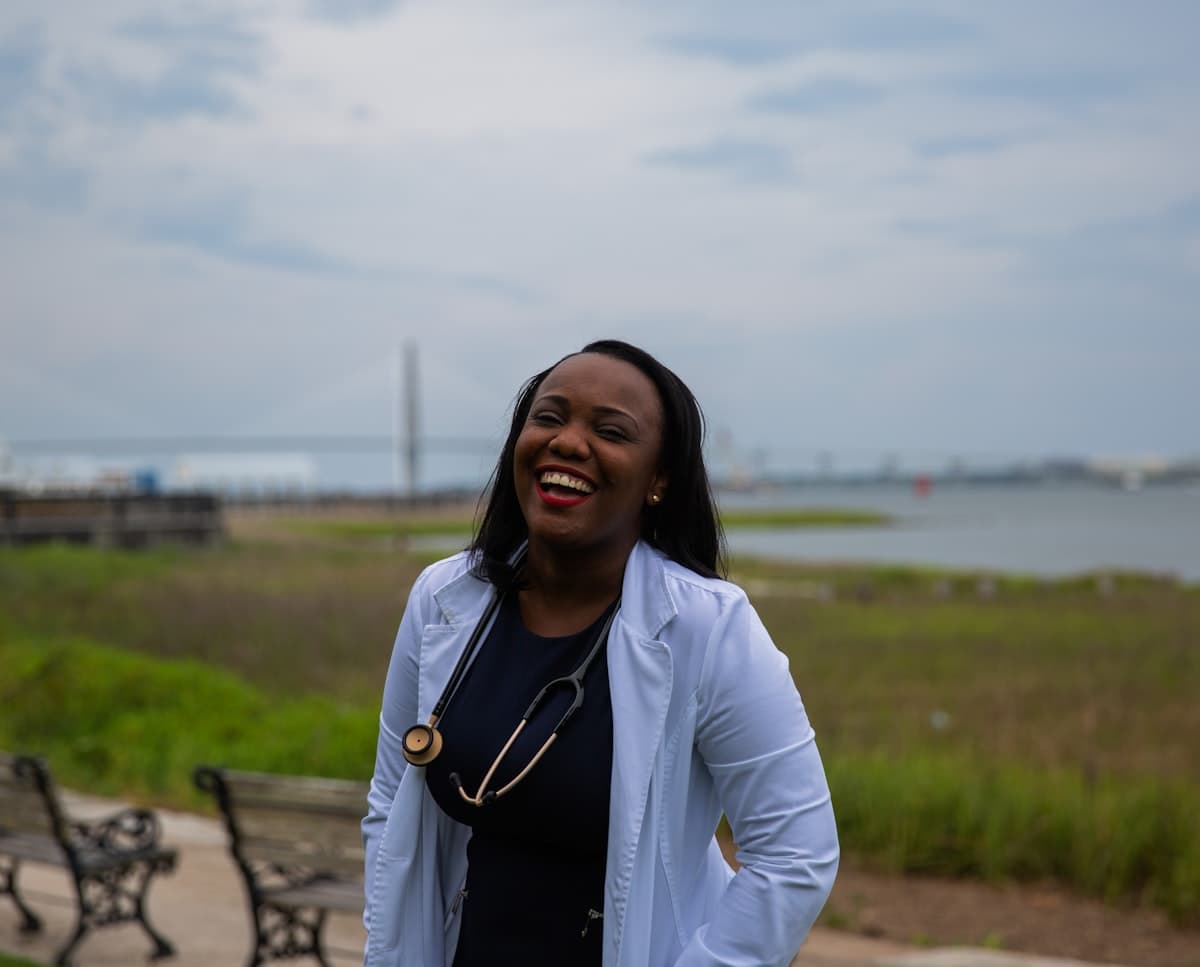 A care professional laughing outdoors